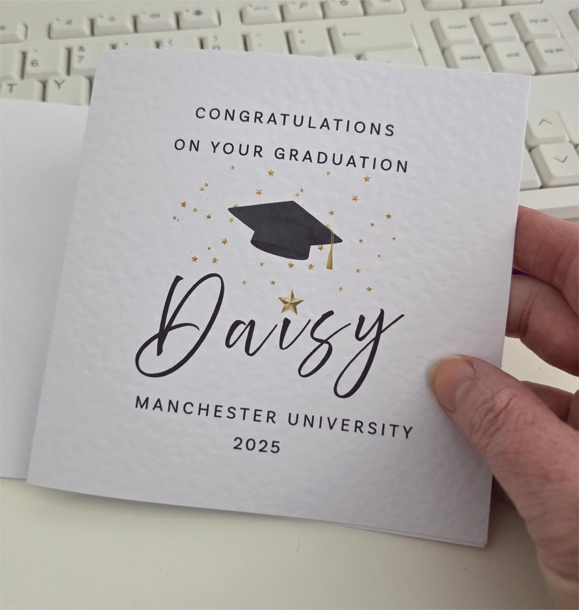 Graduation card with 'Congratulations on your graduation Daisy Manchester University 2025' text